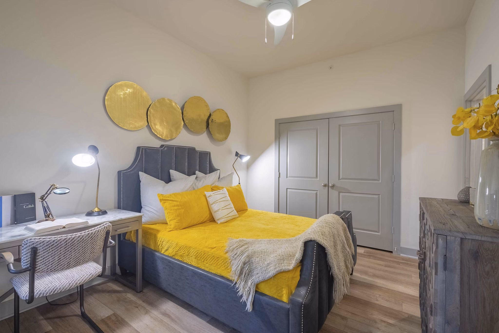 Modern bedroom with sleek furnishings and natural light at Seville Uptown Apartments