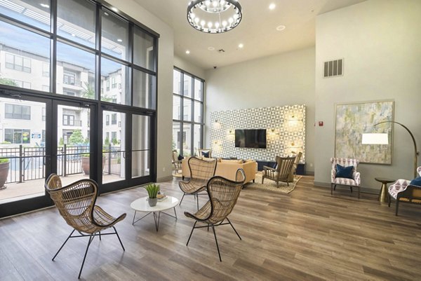 Clubhouse featuring modern furnishings and entertainment space at Seville Uptown Apartments