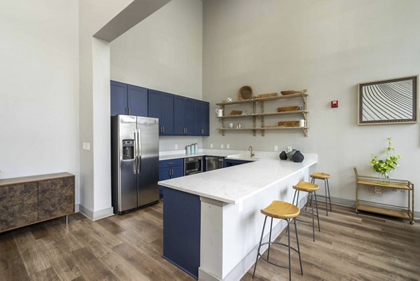 Clubhouse with modern design and comfortable seating at Seville Uptown Apartments
