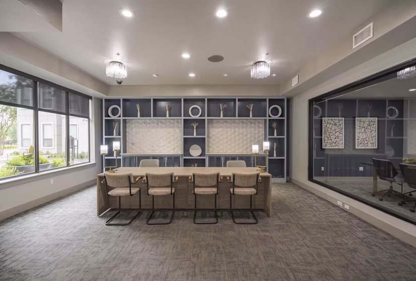 Clubhouse featuring modern decor and seating areas at Seville Uptown Apartments