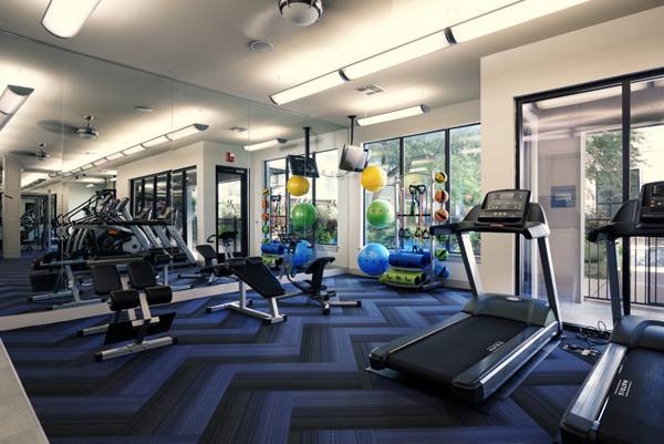 fitness center at Seville Uptown Apartments