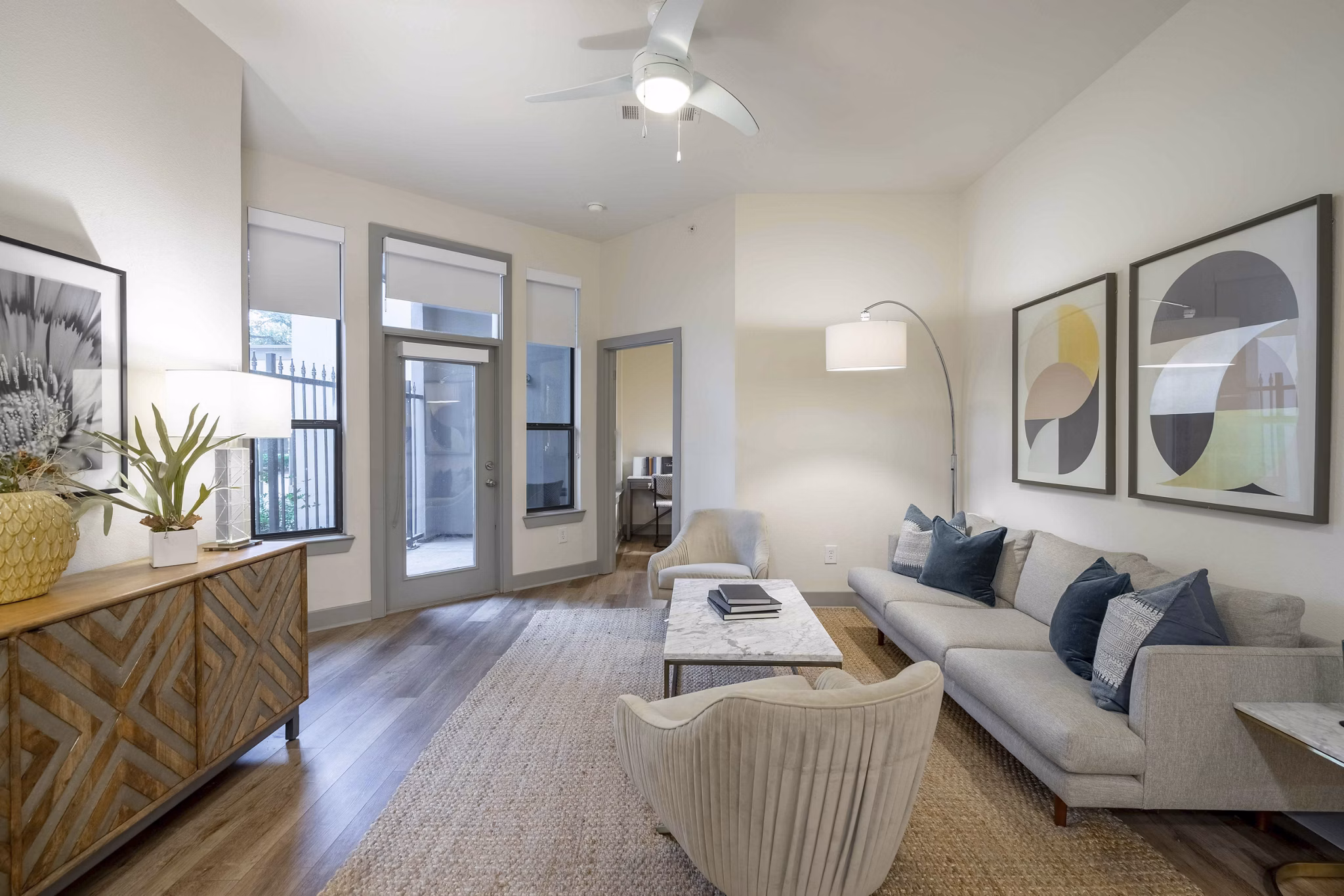 Cozy living room with modern furniture and decor in Seville Uptown Apartments, a luxury property by Greystar