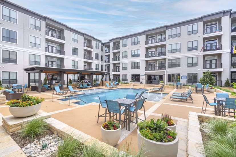 Courtyard with lush greenery at Seville Uptown Apartments, offering luxury outdoor spaces for relaxation and gatherings in the heart of the city