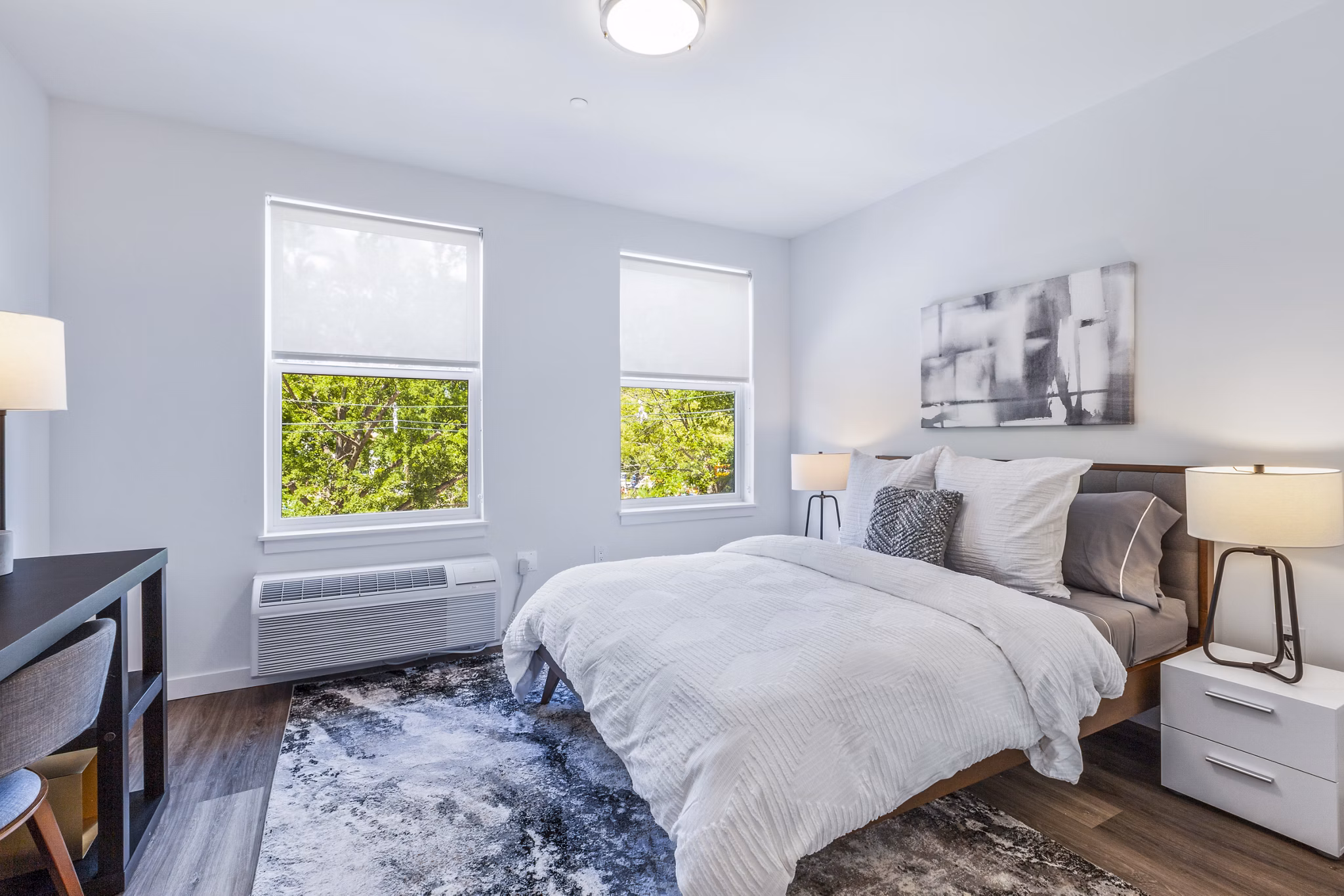 Modern bedroom with elegant decor at The Park at Woodbridge Station Apartments