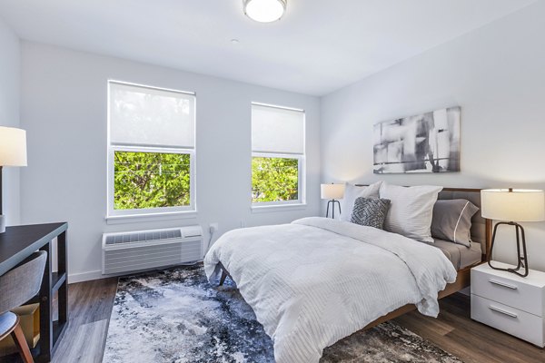 Modern bedroom with elegant decor at The Park at Woodbridge Station Apartments