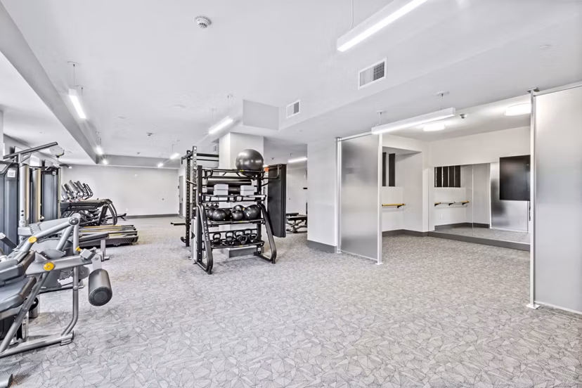 Fitness center with modern equipment at The Park at Woodbridge Station Apartments