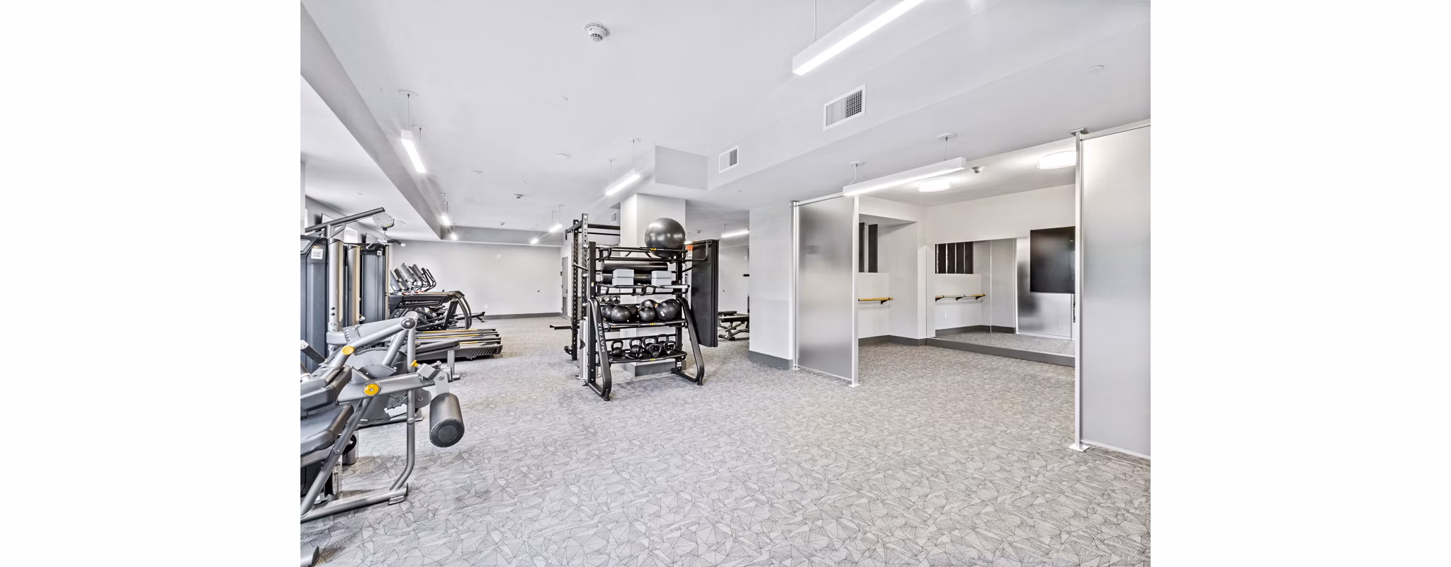 Fitness center with modern equipment at The Park at Woodbridge Station Apartments