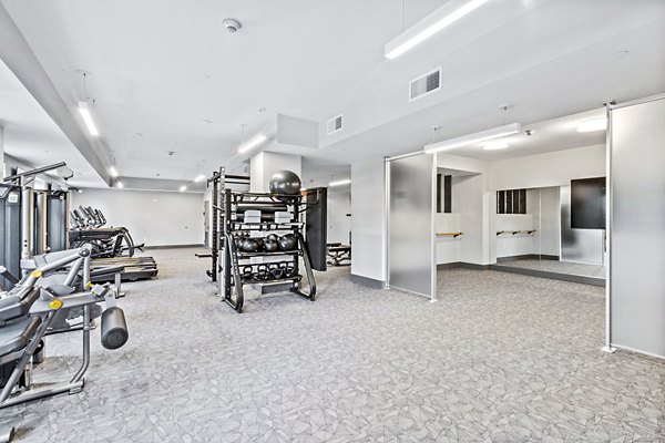 fitness center at The Park at Woodbridge Station Apartments