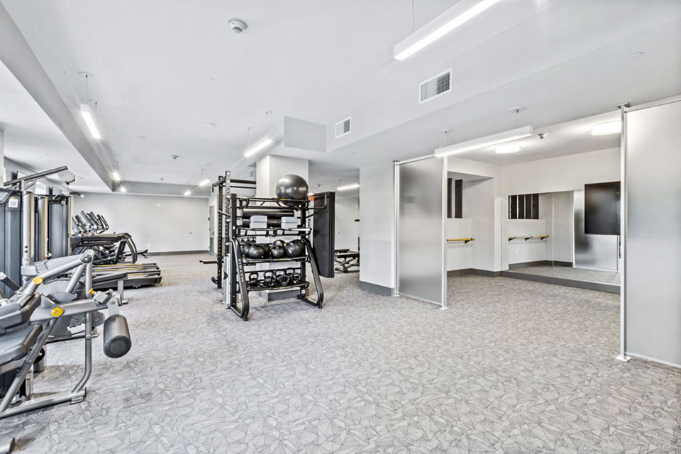 Fitness center with modern equipment at The Park at Woodbridge Station Apartments
