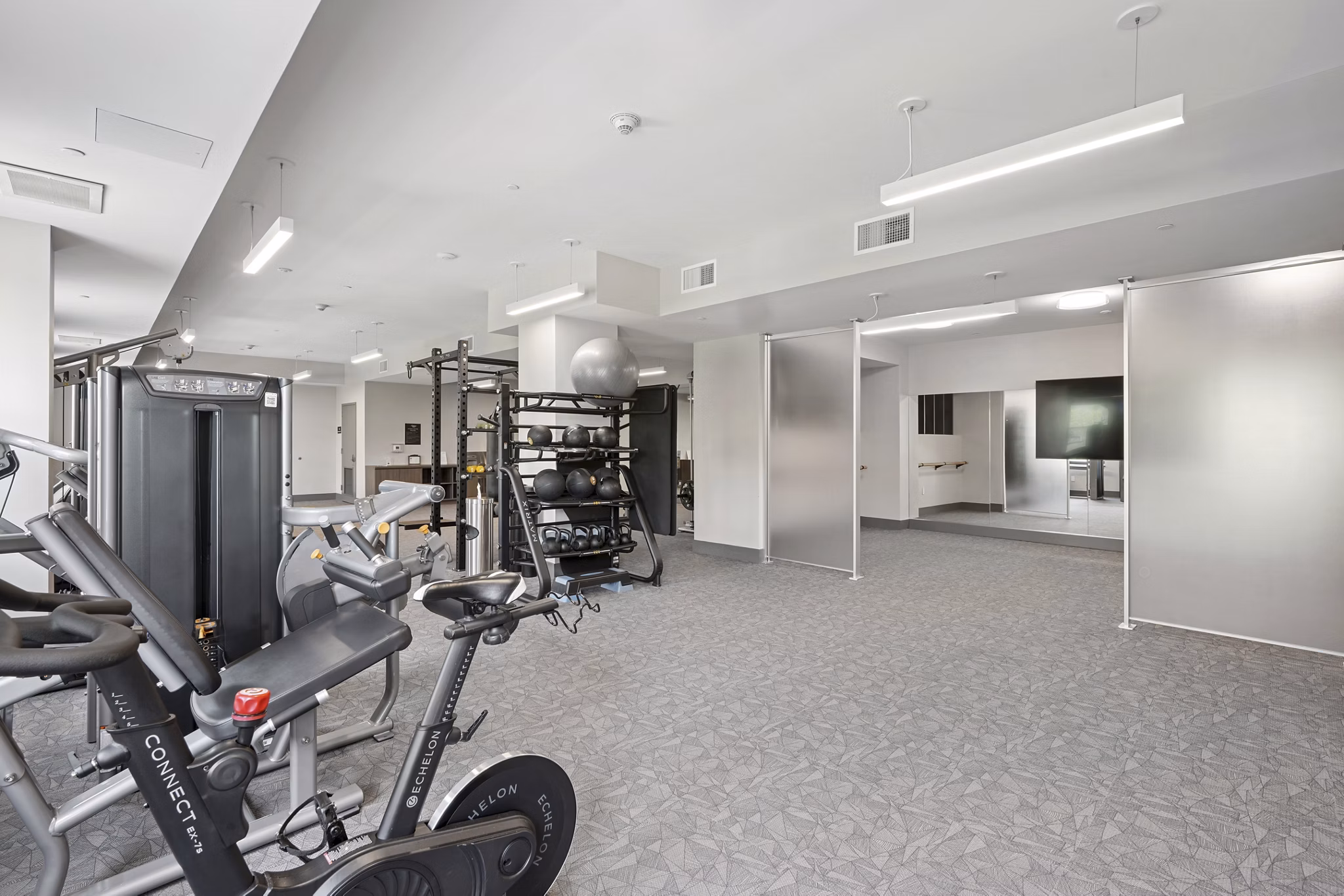 fitness center at The Park at Woodbridge Station Apartments