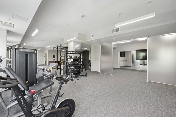 fitness center at The Park at Woodbridge Station Apartments