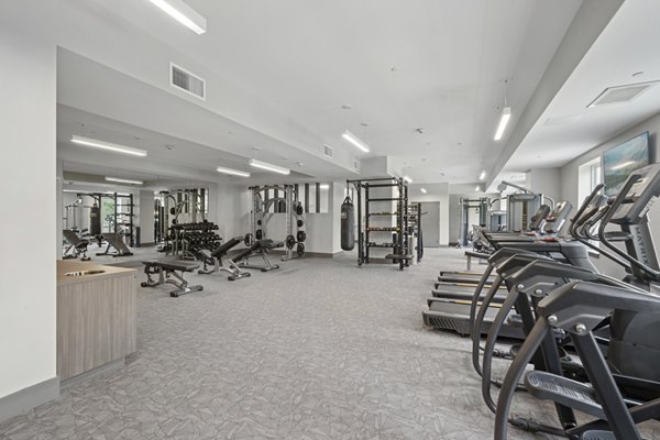fitness center at The Park at Woodbridge Station Apartments