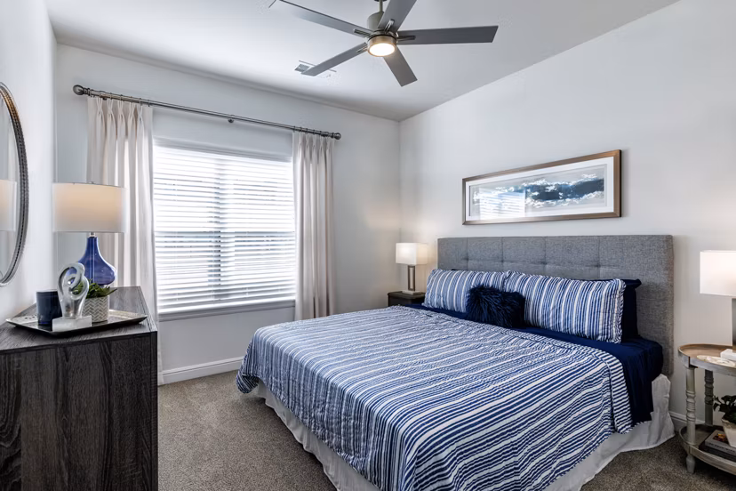 Cozy bedroom with modern decor at Cadence Creek at Gosling Apartments