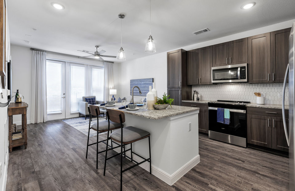 Modern kitchen with stainless steel appliances at Cadence Creek at Gosling Apartments, perfect for luxury living