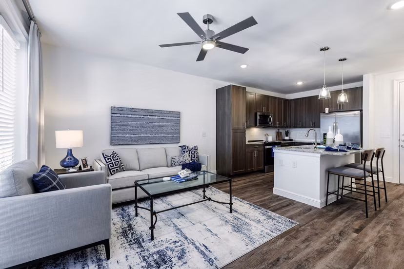 Spacious living room with modern furnishings in Cadence Creek at Gosling Apartments