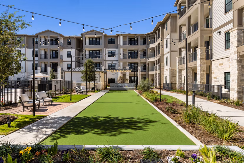 Cadence Creek at Gosling Apartments: Cozy patio with seating and greenery for relaxation