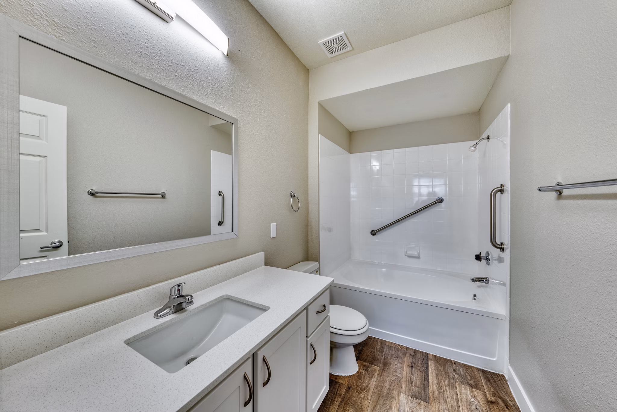 Bathroom featuring sleek fixtures and elegant tiling in Mountainside Apartments