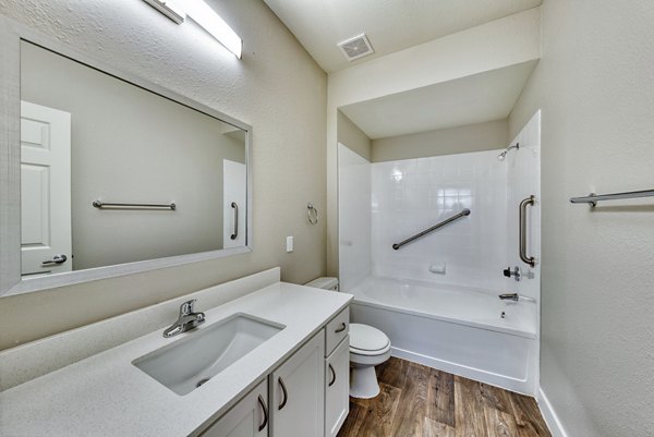 Bathroom featuring sleek fixtures and elegant tiling in Mountainside Apartments
