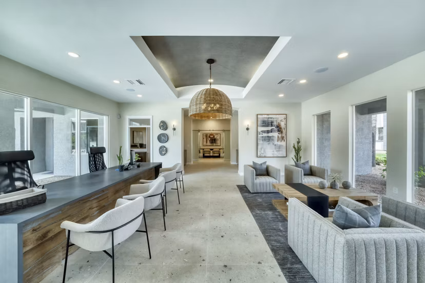Mountainside Apartments: Modern clubhouse with stylish decor and seating options, nestled in a serene setting