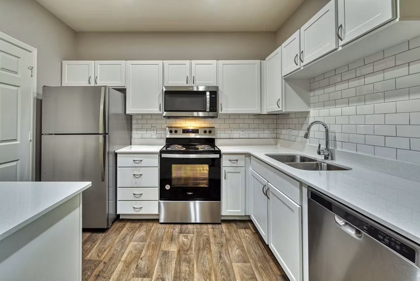 Modern kitchen with stainless steel appliances in Mountainside Apartments