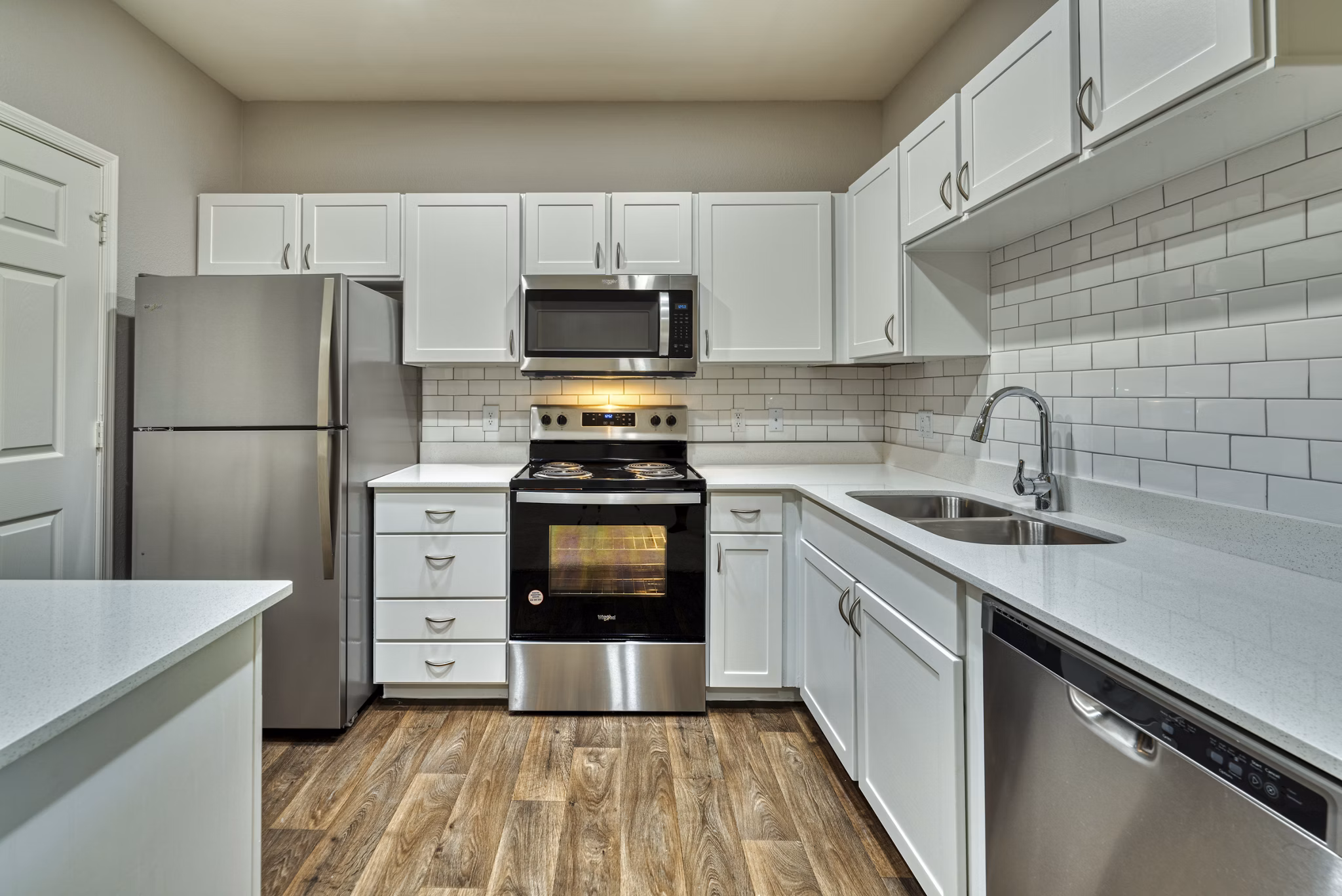Modern kitchen with stainless steel appliances in Mountainside Apartments