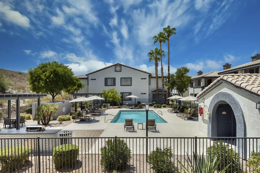 Luxurious outdoor pool at Mountainside Apartments with scenic mountain views, ideal for relaxation and leisure activities