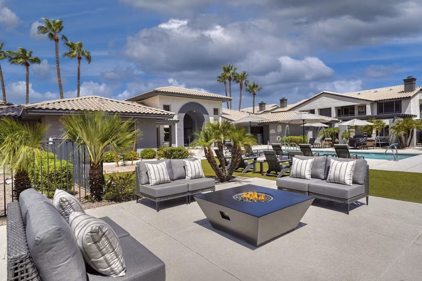 Fire pit surrounded by cozy seating at Mountainside Apartments, luxury Greystar community in scenic setting