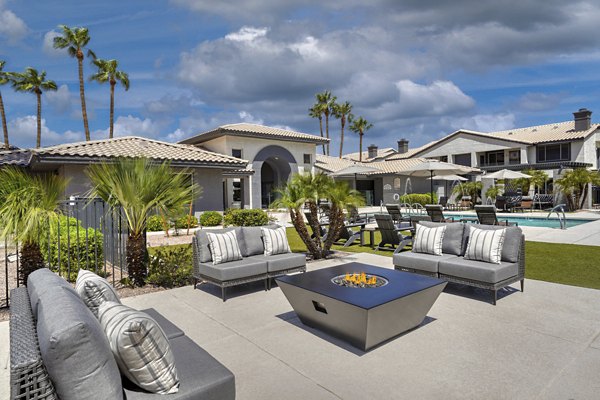 Fire pit surrounded by cozy seating at Mountainside Apartments, luxury Greystar community in scenic setting