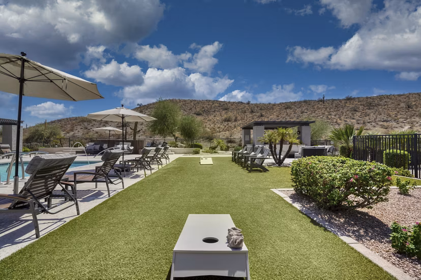 Courtyard featuring lush greenery and seating at Mountainside Apartments