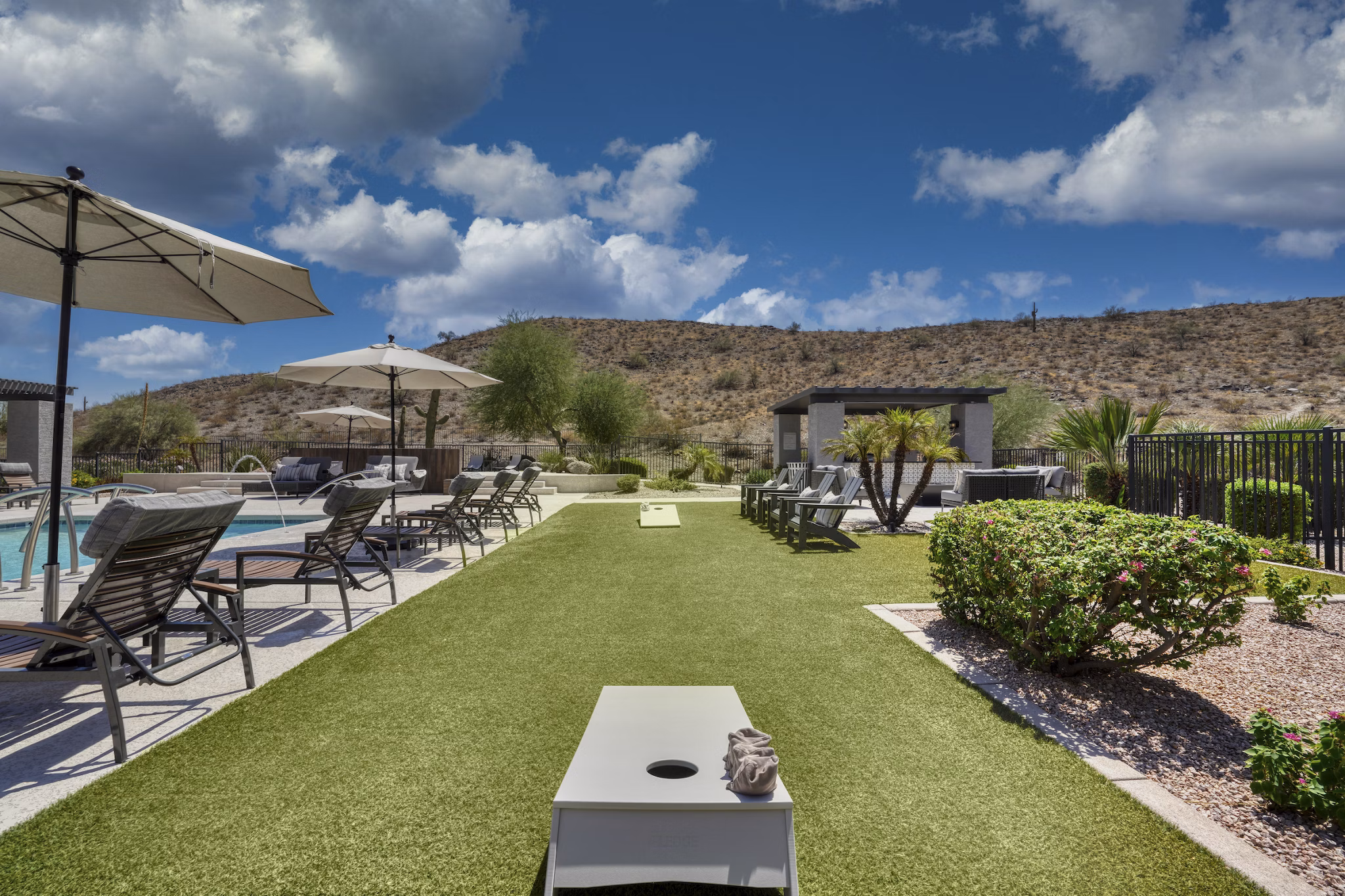 Courtyard featuring lush greenery and seating at Mountainside Apartments