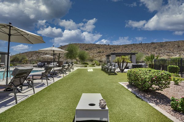 Courtyard featuring lush greenery and seating at Mountainside Apartments