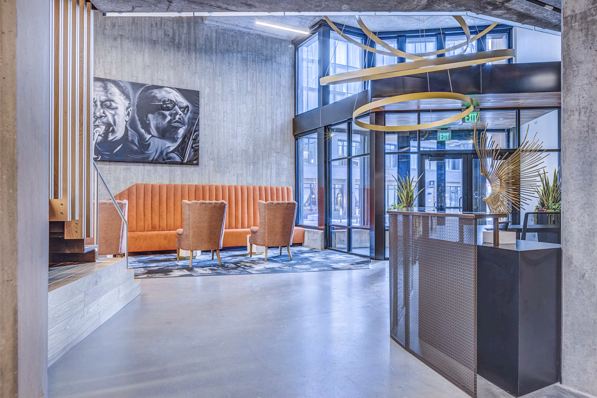 Clubhouse: Elegant lobby with stylish seating and modern decor at The Charles Apartments