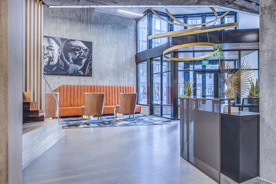 Clubhouse: Elegant lobby with stylish seating and modern decor at The Charles Apartments