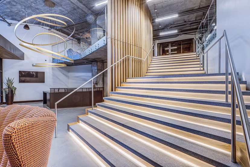 Clubhouse lobby featuring modern decor and comfortable seating at The Charles Apartments, offering luxury living in a prime location