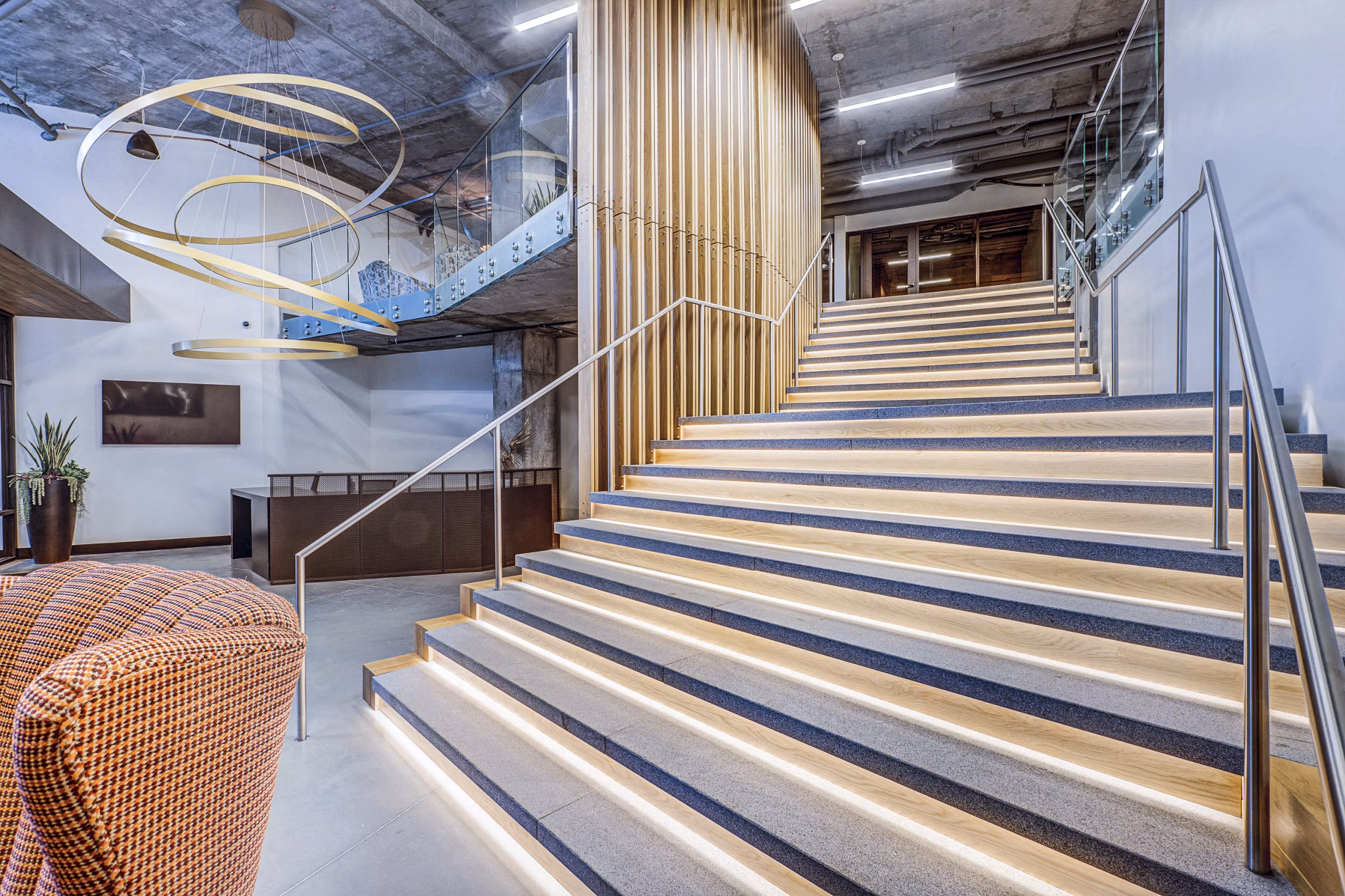Clubhouse lobby featuring modern decor and comfortable seating at The Charles Apartments, offering luxury living in a prime location