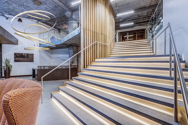 Clubhouse lobby featuring modern decor and comfortable seating at The Charles Apartments, offering luxury living in a prime location