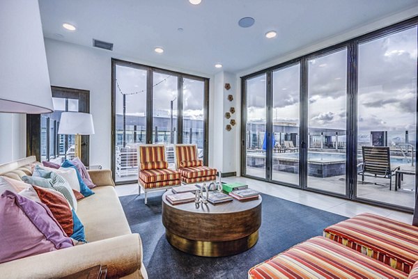 Clubhouse with modern seating and billiards table at The Charles Apartments