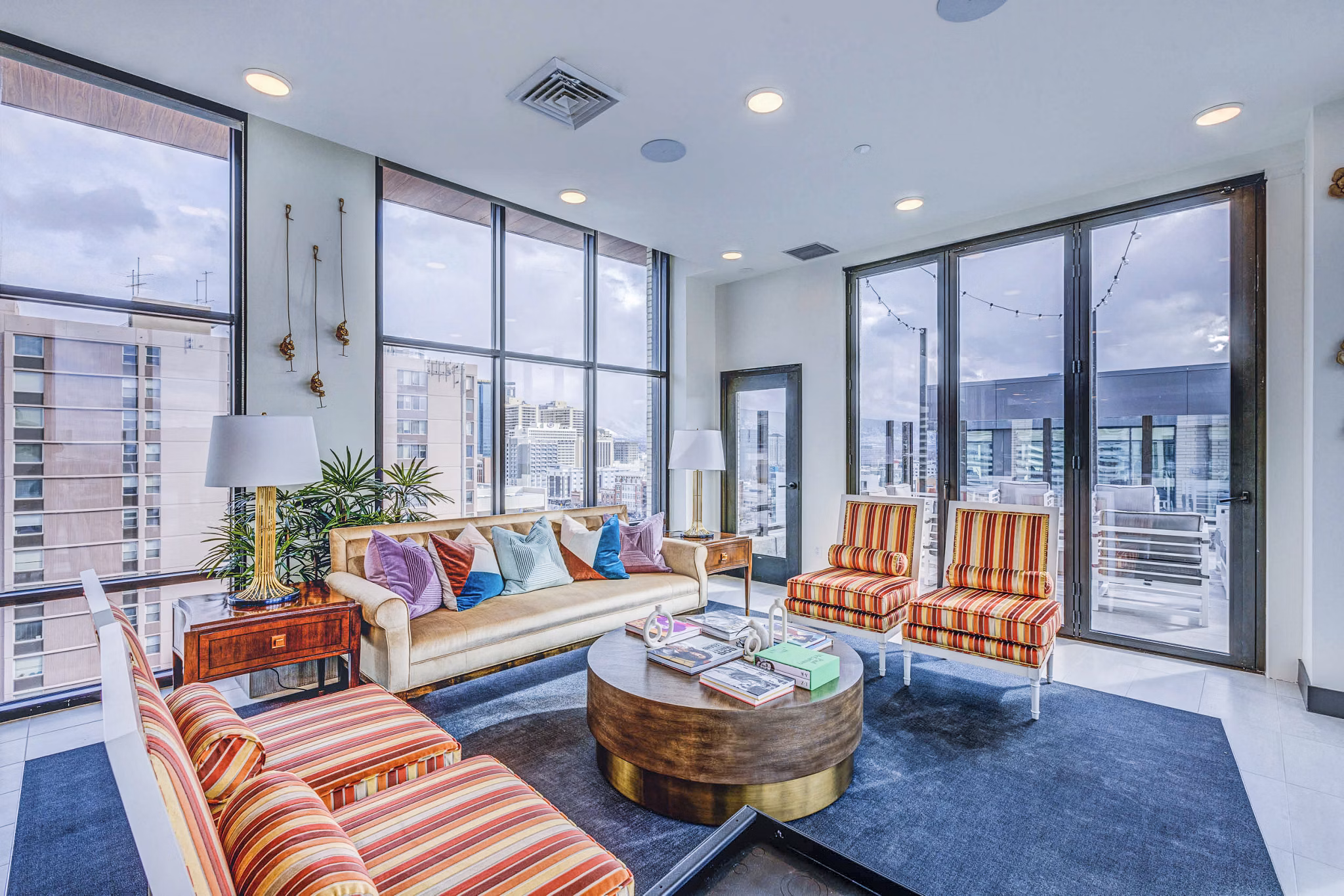 Spacious clubhouse with modern furnishings at The Charles Apartments offering luxury amenities