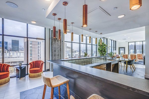 Clubhouse featuring modern seating and entertainment areas at The Charles Apartments, luxury living in a vibrant community