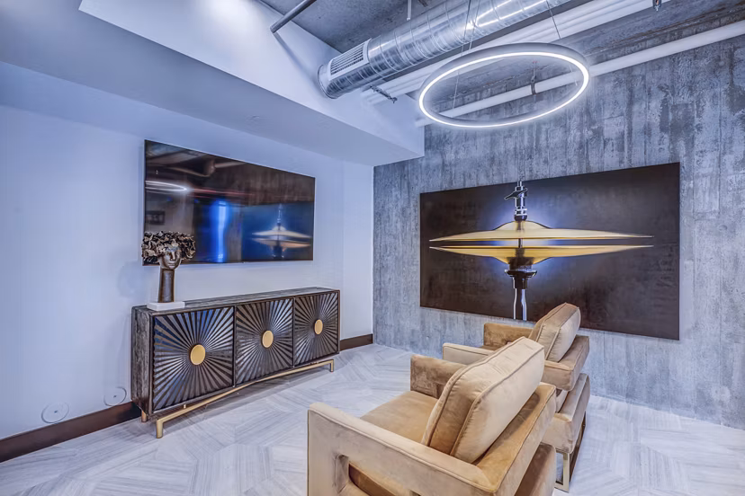 Modern clubhouse with contemporary design at The Charles Apartments in Charlotte, perfect for community gatherings and social events