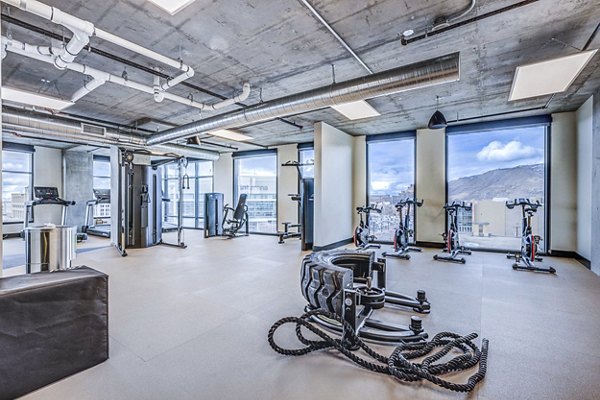 State-of-the-art fitness center featuring modern equipment at The Charles Apartments