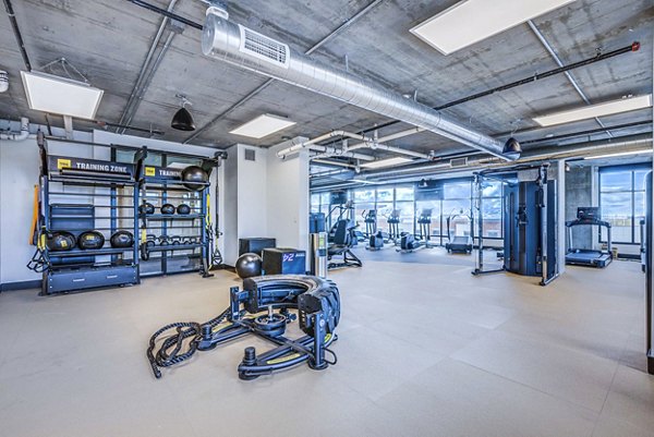 Fitness center with state-of-the-art equipment at The Charles Apartments Perfect for exercise enthusiasts seeking luxury living in a vibrant community