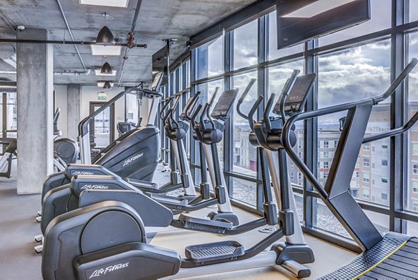 State-of-the-art fitness center with modern equipment at The Charles Apartments