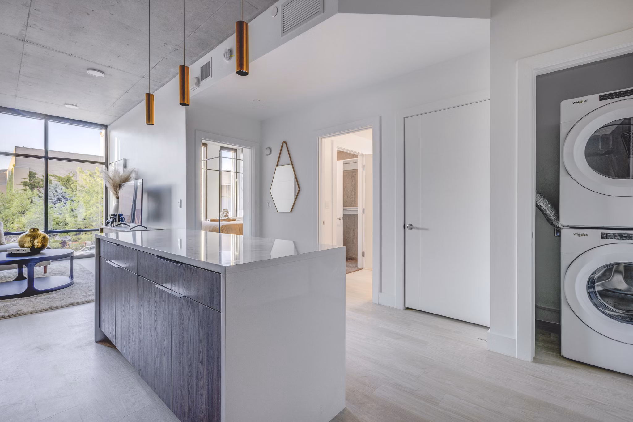 Modern kitchen with stainless steel appliances in The Charles Apartments, offering luxury living in a premium urban setting