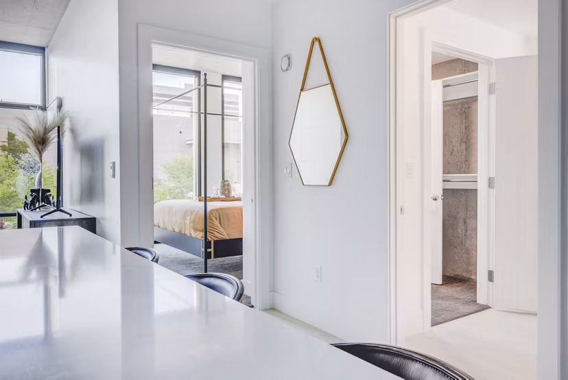 Elegant dining area with modern furnishings at The Charles Apartments
