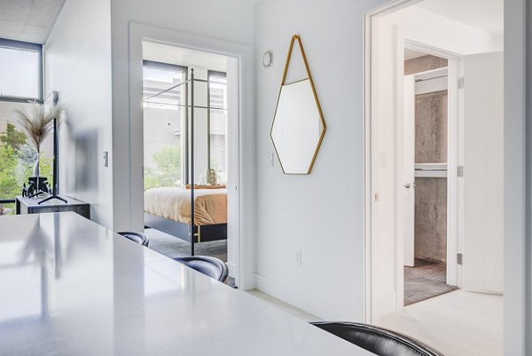 Elegant dining area with modern furnishings at The Charles Apartments