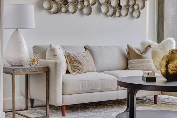 Spacious living room with modern decor in The Charles Apartments