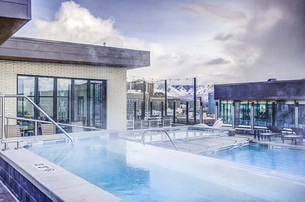 Luxurious pool at The Charles Apartments featuring cabanas and modern design in Greystar's sought-after community