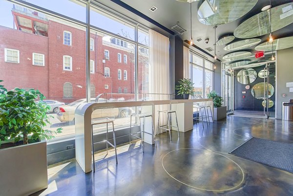 Elegant clubhouse lobby featuring modern decor and seating at 1209 Dekalb Apartments, offering a luxurious experience