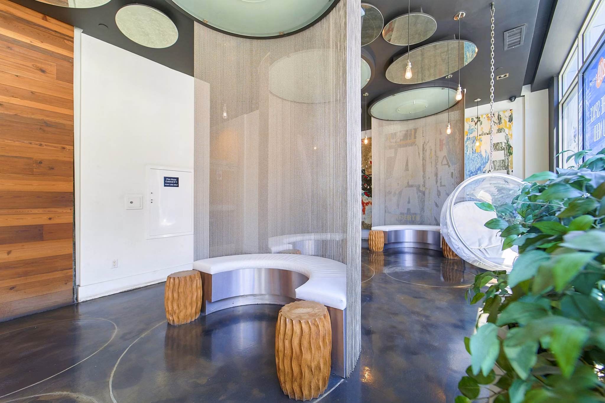 Clubhouse lobby with modern furnishings and bright lighting at 1209 Dekalb Apartments
